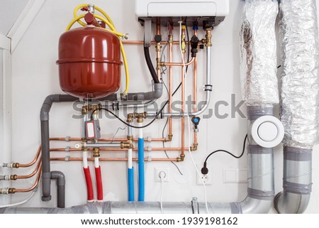 Heating installation and central boiler heating system on wall in house close-up Photo stock © 