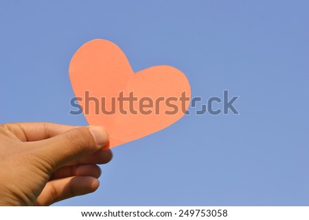 pink heart and hand valentines day background.