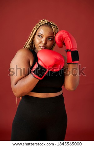 Similar – Image, Stock Photo Smiling overweight ethnic sportswoman against fence and sea