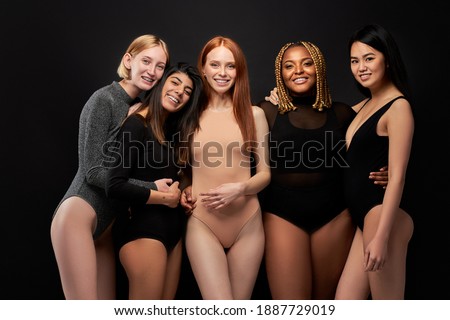 Image, Stock Photo Ethnic model in bodysuit on black background