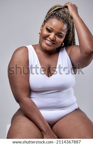 Similar – Image, Stock Photo Curvy woman in bodysuit lying on bed