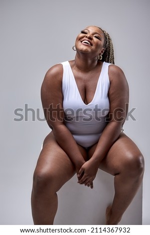 Similar – Image, Stock Photo Curvy woman in bodysuit lying on bed