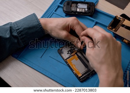 Similar – Image, Stock Photo Crop man fixing microchip in workshop