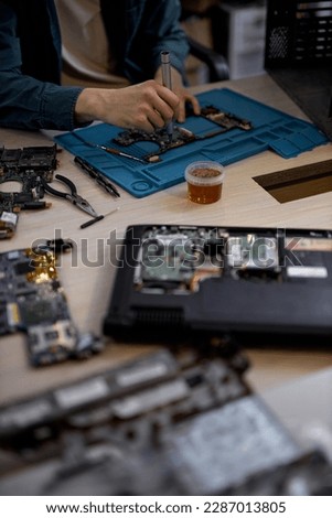 Similar – Image, Stock Photo Crop man fixing microchip in workshop