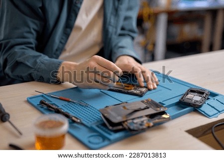 Similar – Image, Stock Photo Crop man fixing microchip in workshop