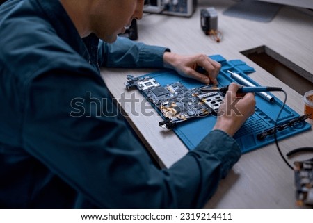 Similar – Image, Stock Photo Crop man fixing microchip in workshop