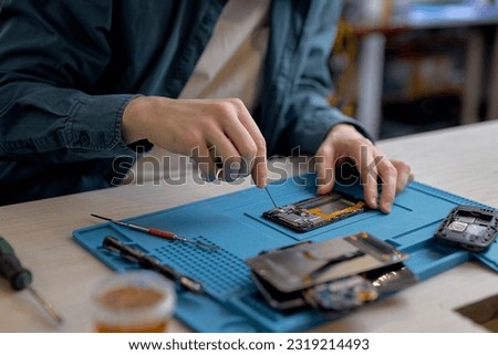 Similar – Image, Stock Photo Crop man fixing microchip in workshop