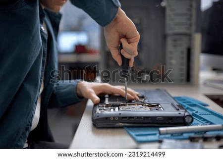 Image, Stock Photo Crop man fixing microchip in workshop