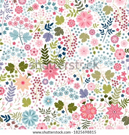 Beautiful ditsy floral seamless pattern with colorful flowers, leaves and berries on white background. Print for fabric, textile, wrapping paper.