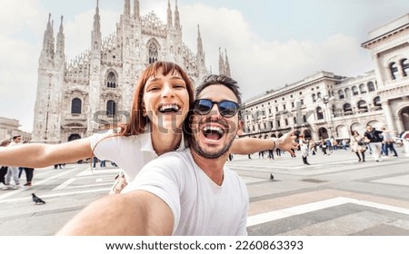 Similar – Image, Stock Photo Young couple taking a selfie while kissing in the mountains