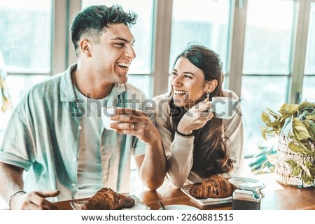 Similar – Image, Stock Photo Happy young couple drinking beverages outdoors