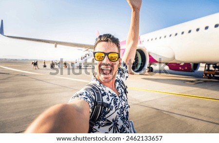 Similar – Image, Stock Photo Male tourist with photo camera standing on rocky lake shore