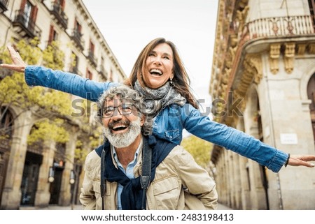 Similar – Image, Stock Photo woman having fun at holi festival showing her coloured hands in the camera