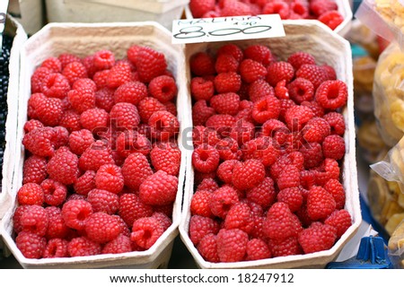 Baskets of raspberries in street market