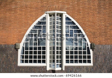 Window of an \'Amsterdamse School\' house. \'The Amsterdamse School\' is a dutch style from the twenties. Houses were build as a palace for the common man.