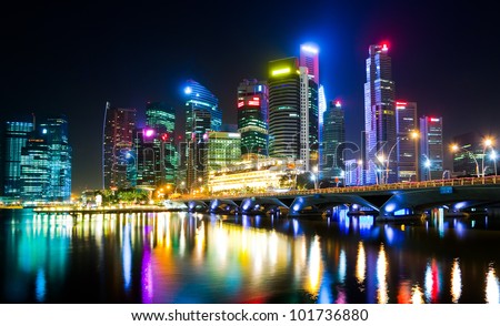 Night view of the city, with artificial light, reflecting on the water surface (Singapore)