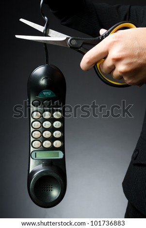 Woman\'s hand, cut off the phone with scissors (business-deprivation issue of communication)