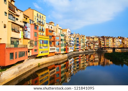 View of the old town with colorful houses reflected in water (Jewish quarter in Girona. Catalonia. Spain.)