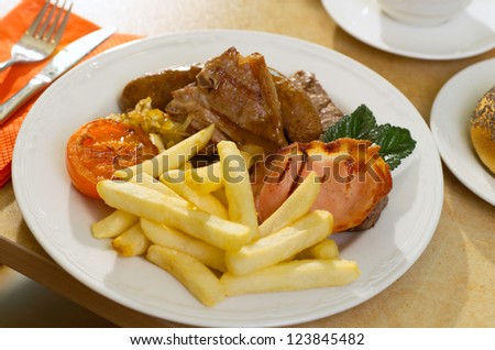 Mixed Grill with bacon, lamb chop, sausage fried tomoato and chips