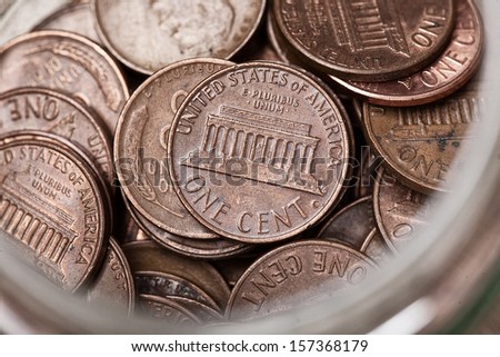 Young childs collection of Pennies in a Jar