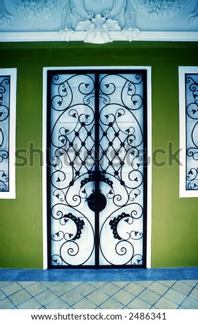 Detail of beautifully ornate wrought iron front door grill, photographed on Infra Red slide film