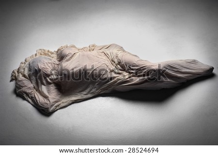 Mysterious image of woman wrapped in cloth shroud