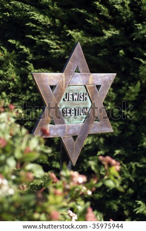 Star of David entrance sign made of copper in Jewish section of Cemetery