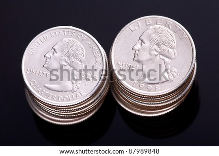 US Quarter Dollars with George Washington on the head with an Eagle on the reverse