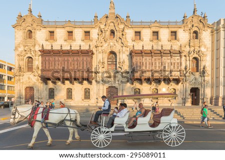Lima, Peru - 16 APRIL 2015 : Travellers sit on a horse carriage in order to look around Lima city, Peru