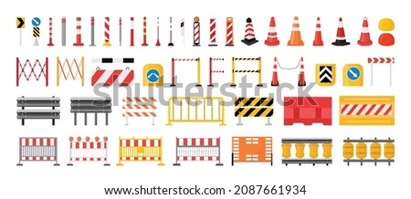 Collection of road barriers and signs.
