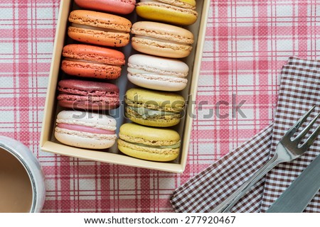 A box of colorful macarons, Close up photo and vintage chrome color style