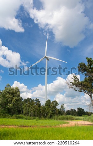 One Wind turbine generating electricity in green filed