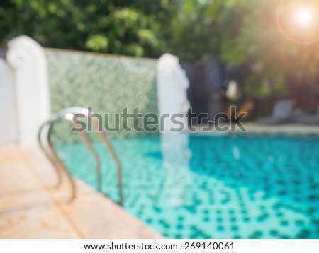 Abstract blurred photo of public swimming pool and pool stair with sunlight