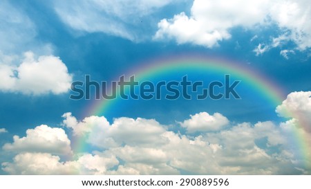 Beautiful blue sky background and white clouds with rainbow in summer and good weather day.