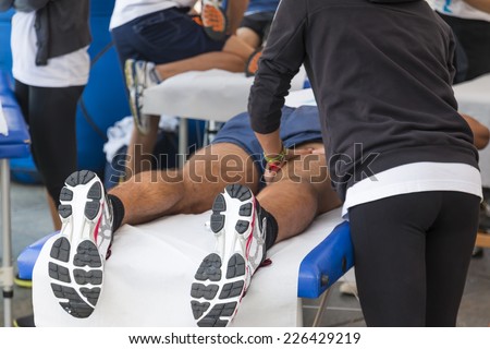 athletes relaxation massage before sport event, marathon muscles massage