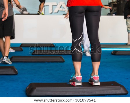 Female Legs on Step Board During Exercise
