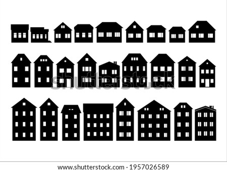 Black and white silhouette clipart of houses and buildings in small-town street
