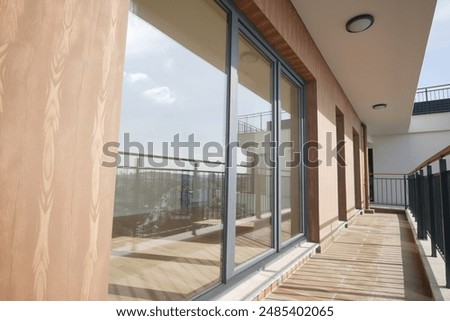 Similar – Image, Stock Photo Minimalist balcony door with shiny knob