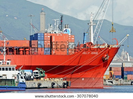 GENOA, ITALY - JULY 13, 2014: The cargo ship Jolly Arancione of the company Messina , stops at the quay. In February 2012 the ship was attacked by pirates off Somalia.