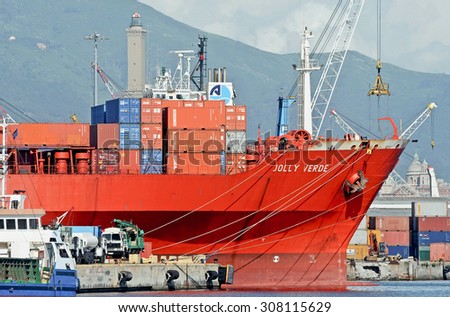 GENOA, ITALY - JULY 13, 2014: The cargo ship Jolly Verde of the company Messina , stops at the quay. In February 2012 the ship was attacked by pirates off Somalia.