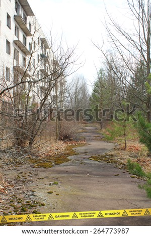 Derelict street and building in Chernobyl Zone. Ukraine. Signs of radiation hazard