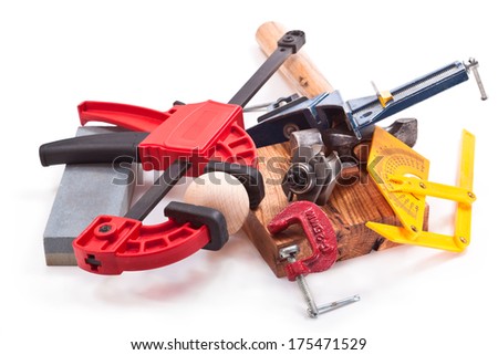 Clamps, wooden ball, a hammer, a protractor, cutter for wood, grinding stone on a white background