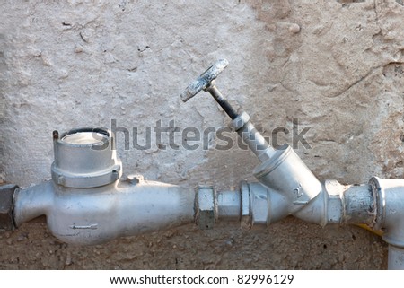 water meter and valve to the pipe