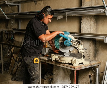 Similar – Image, Stock Photo Male worker using electric grinder in workshop