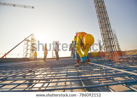 Construction workers fabricating steel reinforcement bar at the construction site 商業照片 © 