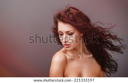 Beautiful woman with curly hair and evening make-up. Beauty. Fashion art photo