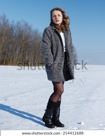 Beauty Girl Outdoor. Freedom concept. Beauty Girl over Sky. Beautiful female in windy conditions in a field