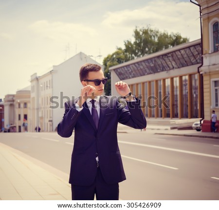 Portrait of an handsome businessman in an urban setting