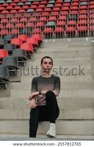 Similar – Image, Stock Photo Thoughtful young female athlete listening to music in studio