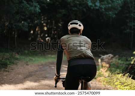 Similar – Image, Stock Photo Cyclist rides through image